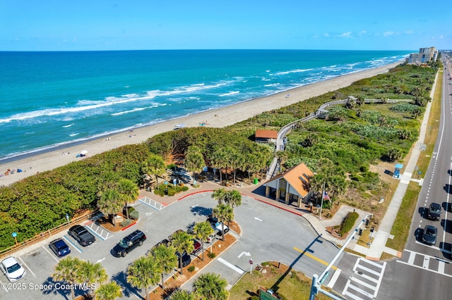 aerial view with a view of the beach and a water view