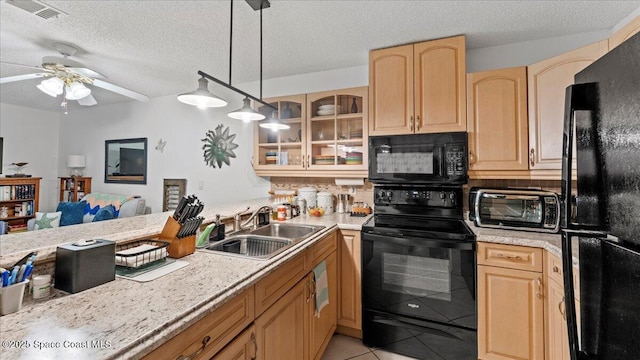 kitchen with black appliances, decorative light fixtures, decorative backsplash, sink, and light tile patterned floors