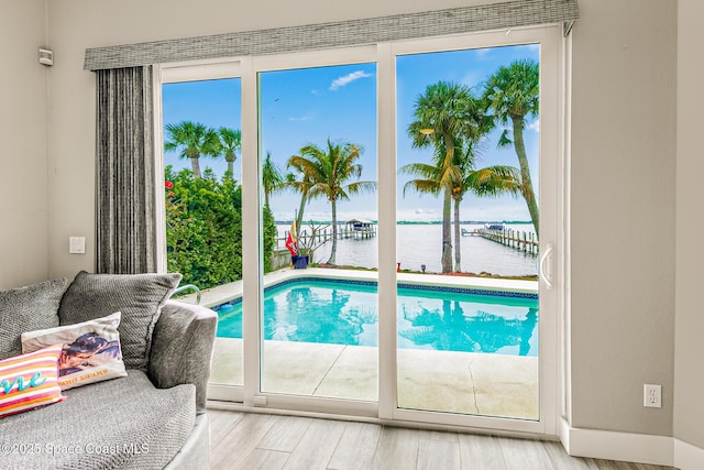 view of swimming pool featuring a water view