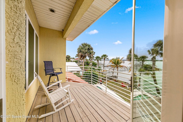 balcony featuring a water view