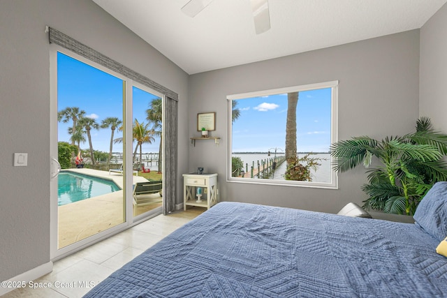 bedroom featuring access to exterior, ceiling fan, and light tile patterned flooring