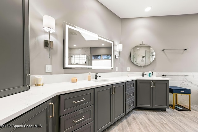 bathroom featuring wood-type flooring, vanity, and walk in shower