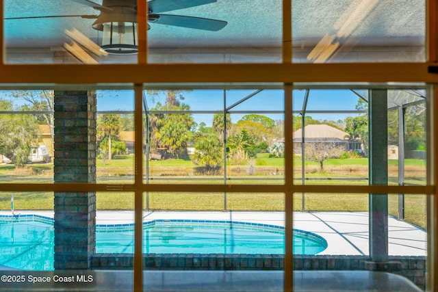 view of swimming pool with ceiling fan