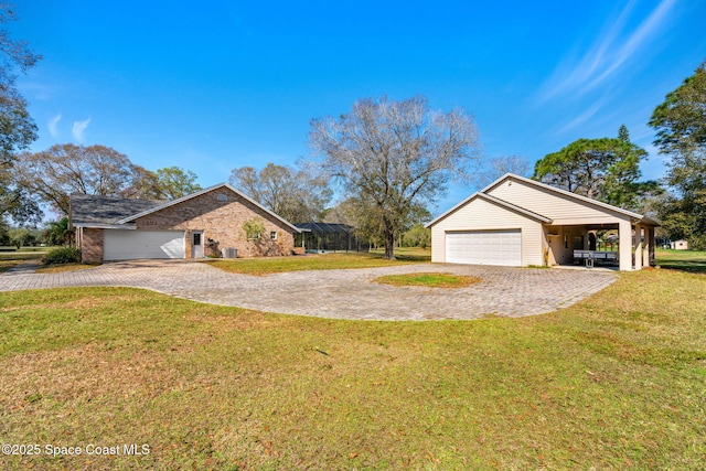 view of side of property with a garage and a yard