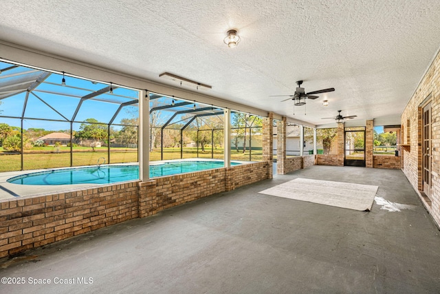 exterior space featuring a lanai and ceiling fan