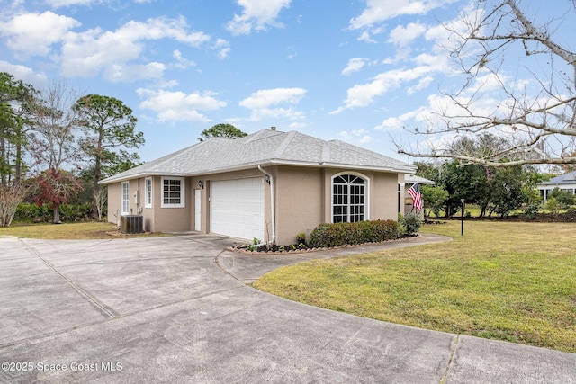 view of side of property featuring cooling unit, a garage, and a lawn