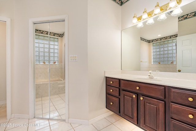 bathroom with vanity, a shower, and tile patterned floors