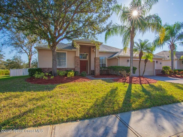 view of front of house featuring a garage and a front yard