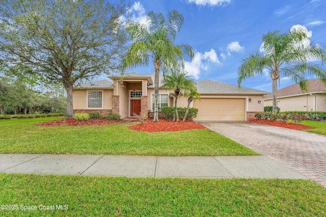 view of front of property with a garage, a front lawn, decorative driveway, and stucco siding