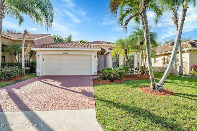 mediterranean / spanish-style home with a garage and a front yard