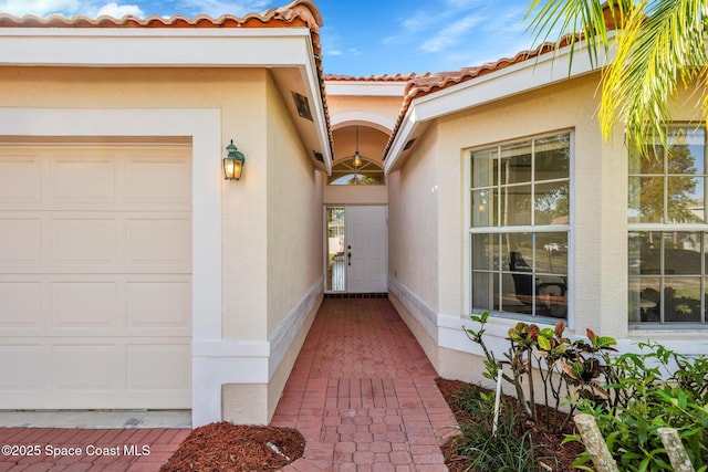 doorway to property featuring a garage