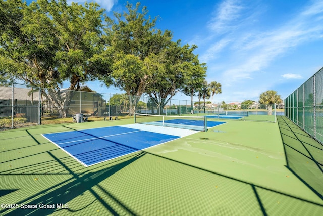 view of tennis court featuring basketball court