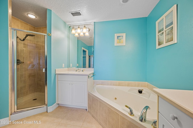 bathroom with a textured ceiling, separate shower and tub, tile patterned flooring, and vanity