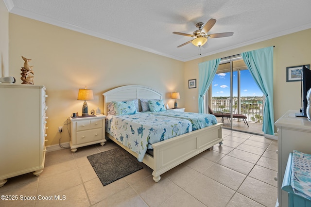 bedroom with a textured ceiling, access to outside, ceiling fan, light tile patterned floors, and ornamental molding