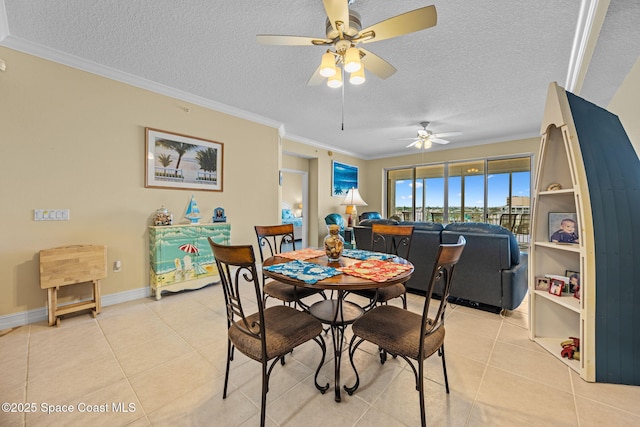 dining space featuring a textured ceiling, light tile patterned flooring, ceiling fan, and crown molding