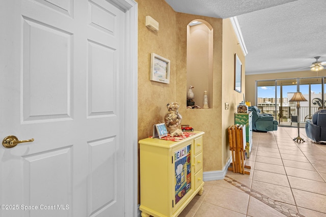 hallway with light tile patterned floors