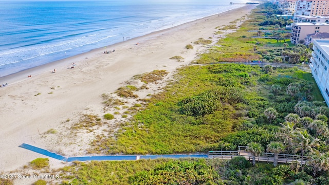 bird's eye view with a beach view and a water view