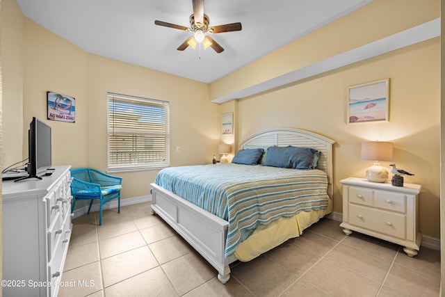 bedroom with ceiling fan and light tile patterned floors