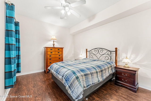 bedroom featuring dark wood-type flooring and ceiling fan