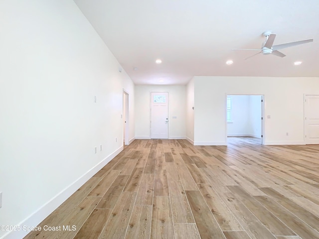 interior space with ceiling fan and light hardwood / wood-style flooring