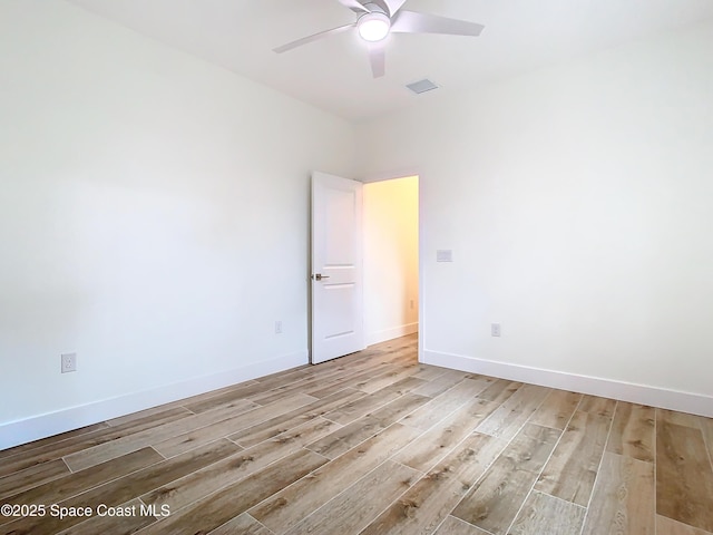 unfurnished room featuring ceiling fan and light wood-type flooring