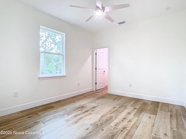 spare room featuring ceiling fan and light hardwood / wood-style floors