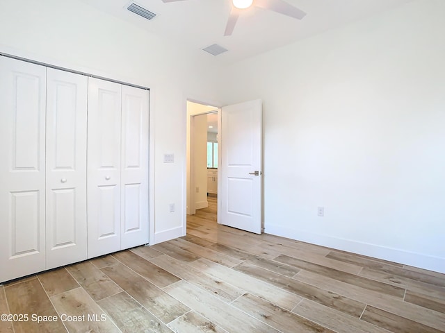 unfurnished bedroom with a closet and ceiling fan