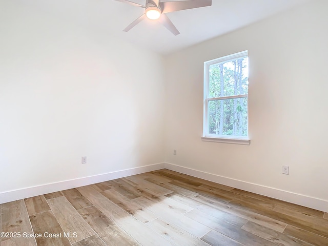 spare room featuring ceiling fan and light hardwood / wood-style floors