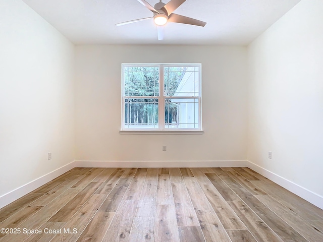 spare room with ceiling fan and light hardwood / wood-style floors