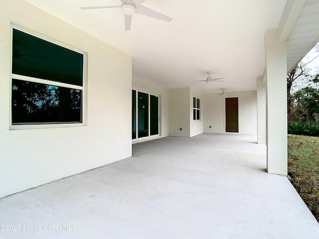 view of patio featuring ceiling fan