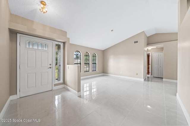 foyer with vaulted ceiling