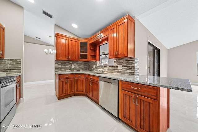 kitchen with decorative light fixtures, vaulted ceiling, kitchen peninsula, sink, and appliances with stainless steel finishes