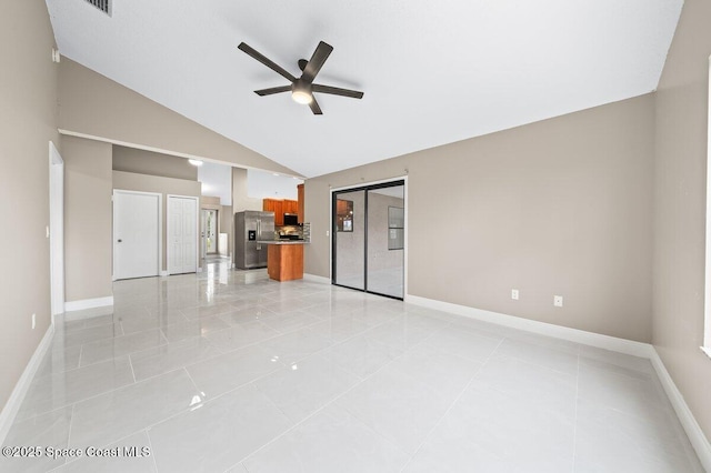 unfurnished living room with ceiling fan, light tile patterned flooring, and high vaulted ceiling