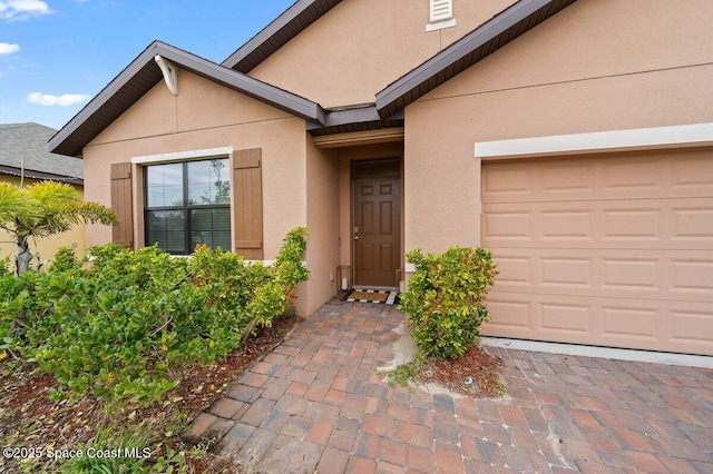 property entrance with a garage