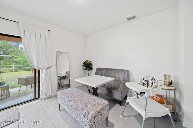 sitting room featuring light tile patterned floors