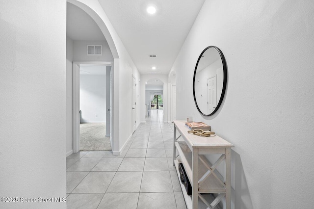 hallway with light tile patterned floors