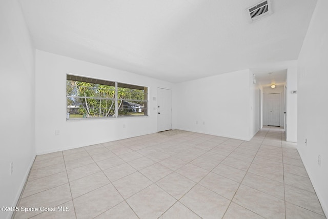 unfurnished room with light tile patterned floors