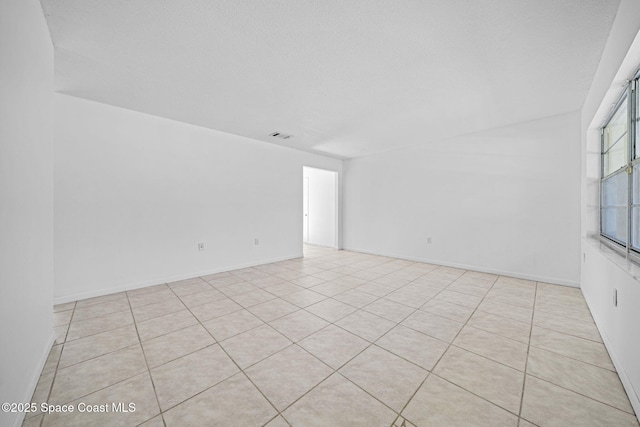 view of tiled spare room