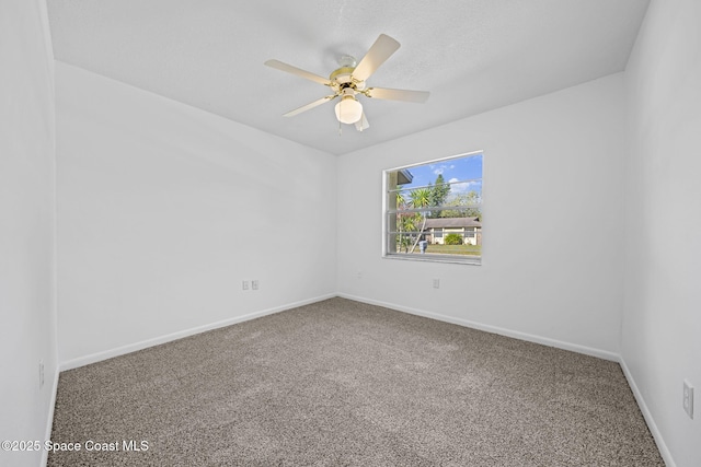 spare room with carpet flooring and ceiling fan