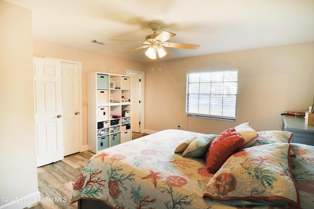 bedroom featuring light wood-type flooring and ceiling fan