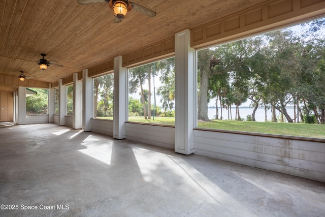 unfurnished sunroom with wood ceiling