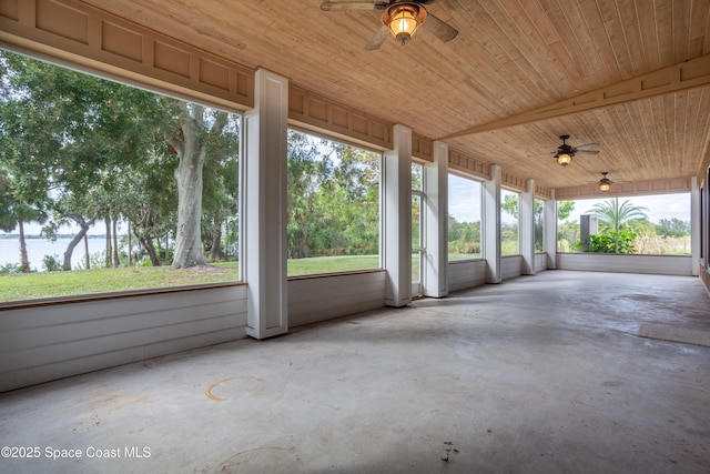 unfurnished sunroom with wood ceiling