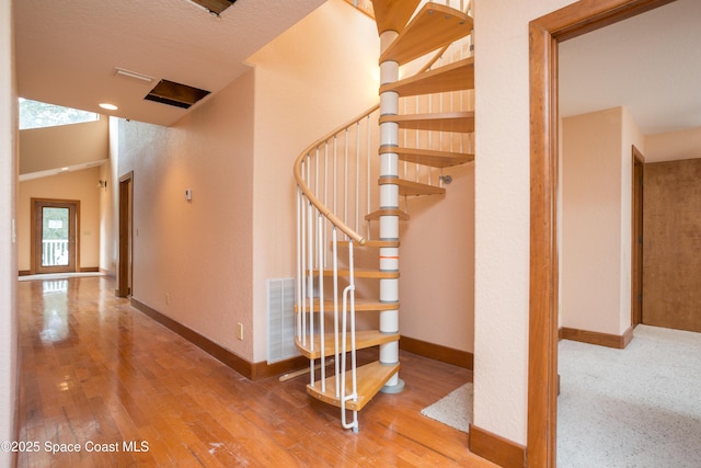 stairs with wood-type flooring