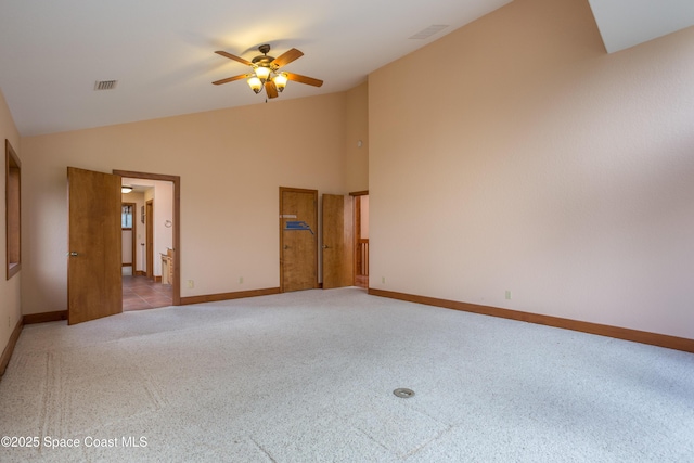 unfurnished room with lofted ceiling, ceiling fan, and light carpet