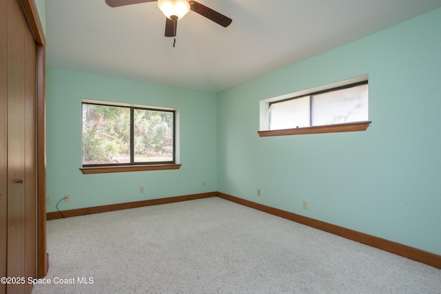 spare room with ceiling fan