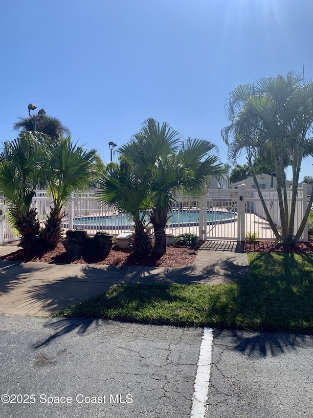 view of yard featuring a community pool