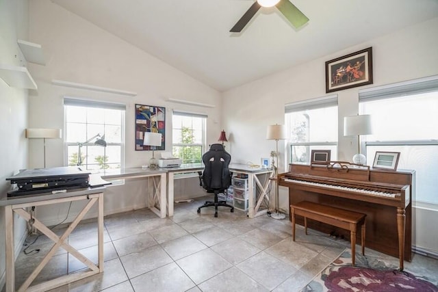 tiled office space featuring vaulted ceiling, plenty of natural light, and ceiling fan