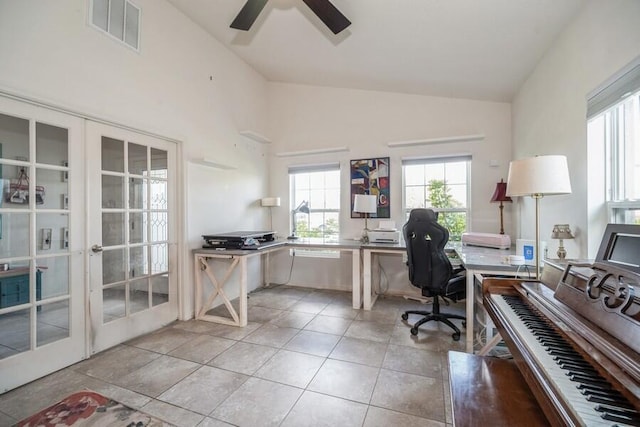 office featuring light tile patterned flooring, lofted ceiling, and french doors