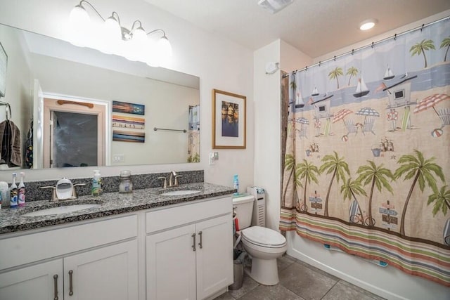 full bathroom with vanity, shower / bath combination with curtain, and toilet