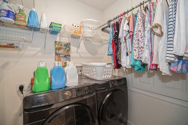 laundry room featuring washing machine and clothes dryer